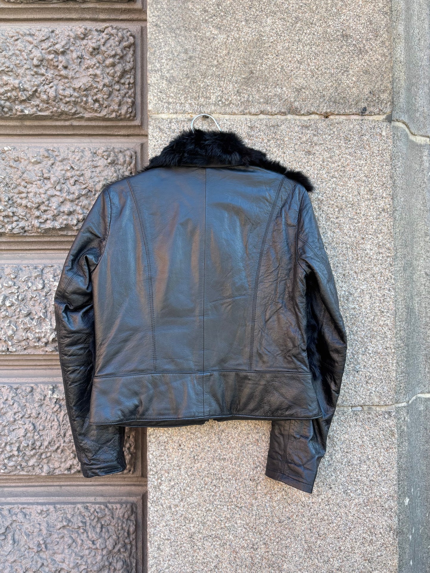 Leather jacket with fur details
